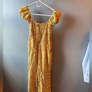 Anthropology Jumpsuit, faithful the brand. Cute yellow with floral print